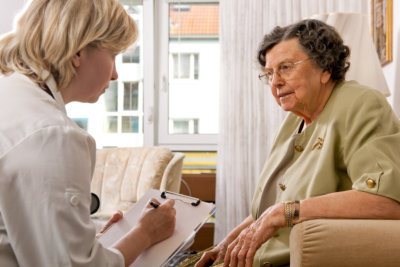 portrait of senior woman being interviewed by a counselor